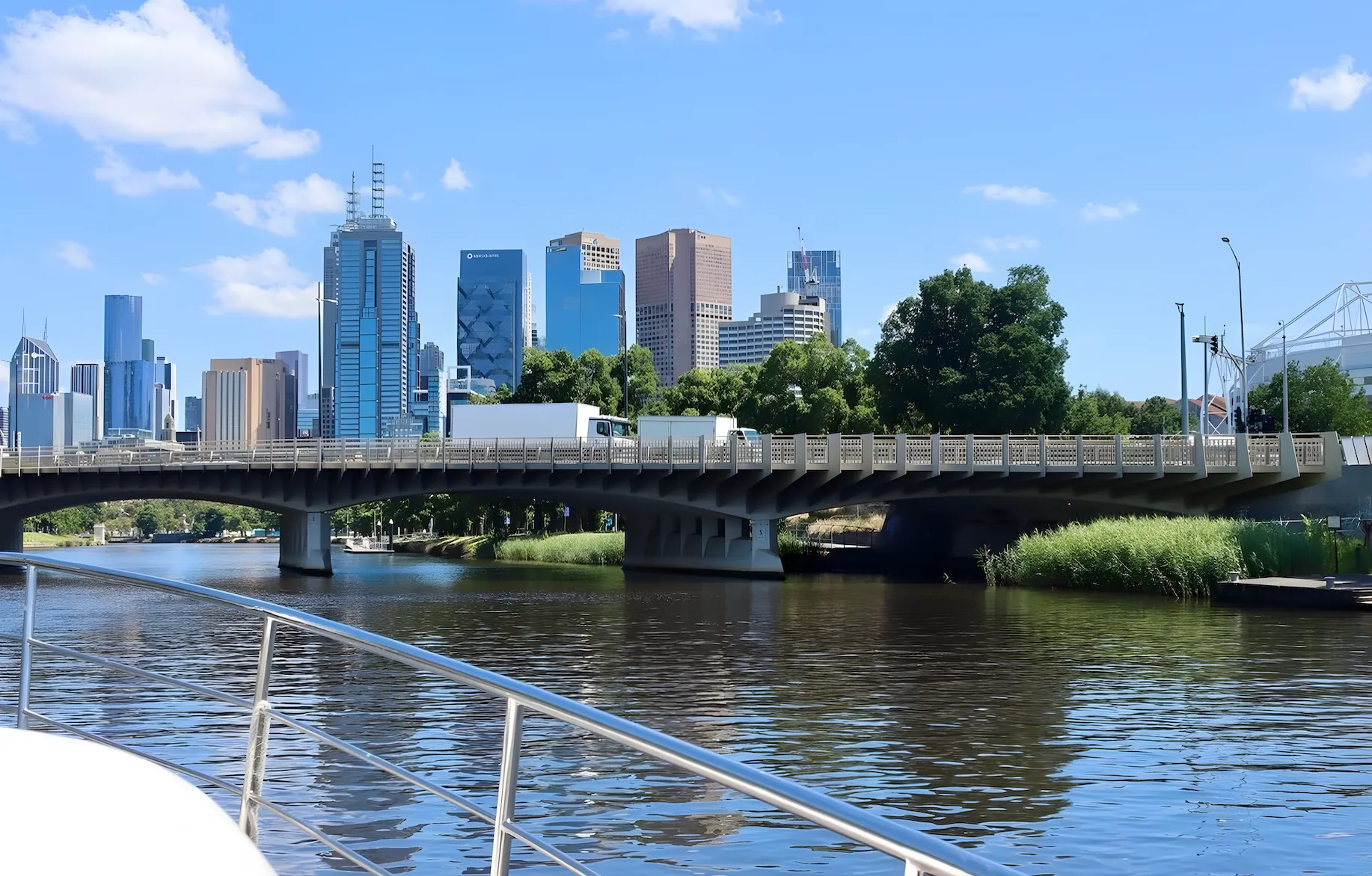 The Yarra from Elizabeth Anne's bow rail, city bridge and CBD skyline ahead